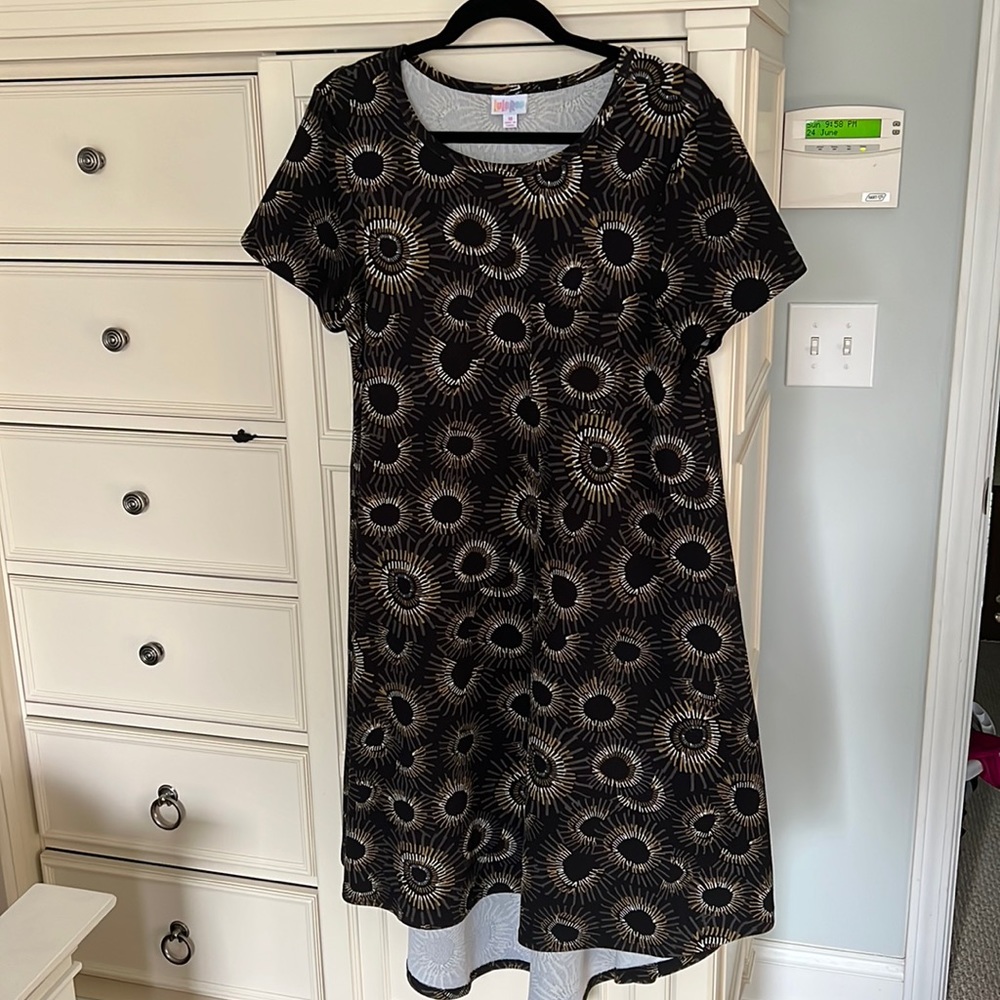 Lularoe Carly dress size M. Black background with gold and cream design.